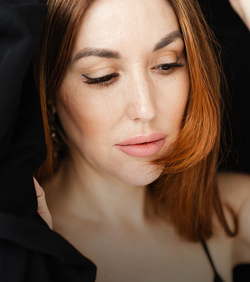 Bakersfield Med Spa model with red hair and soft makeup.