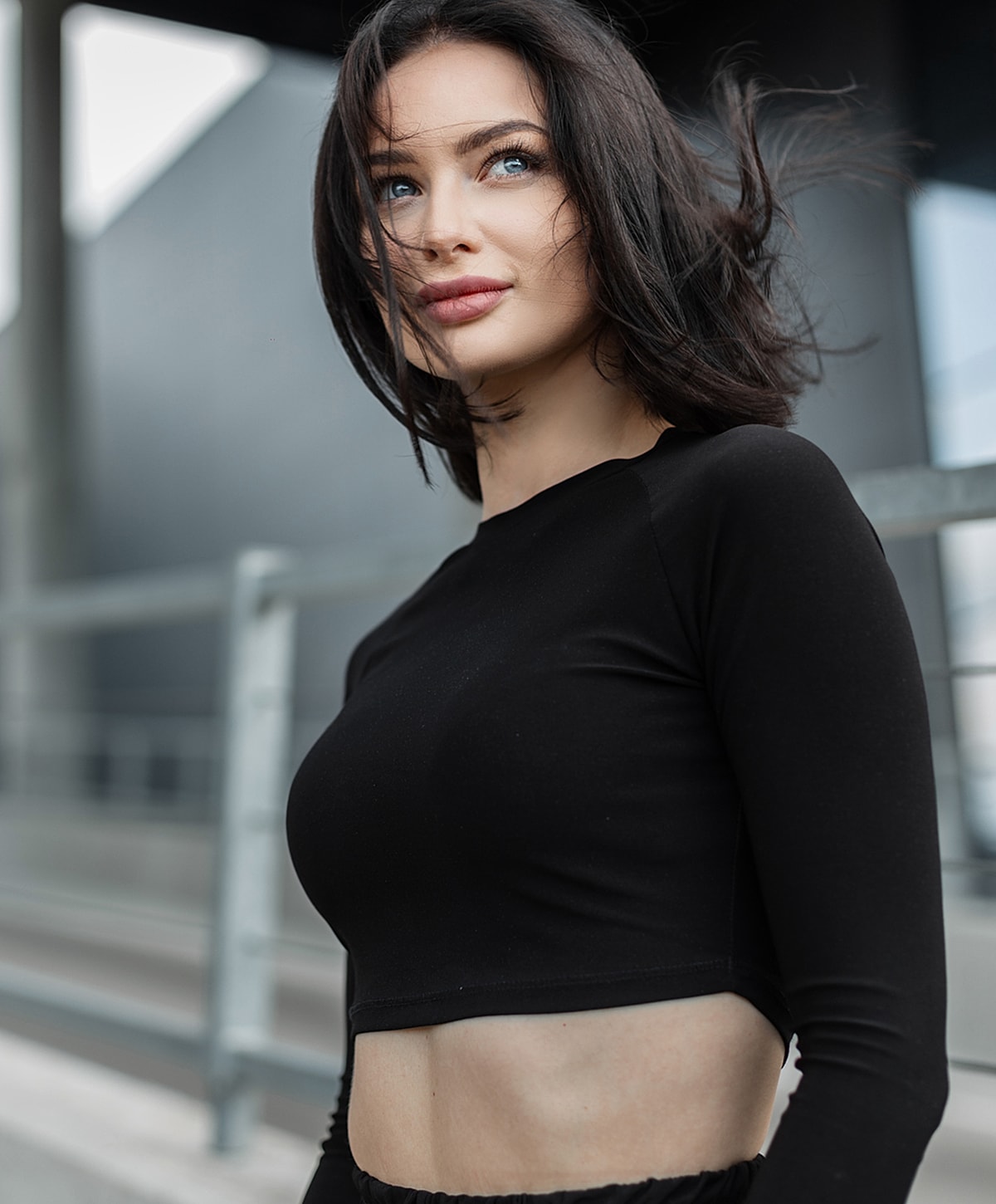 Bakersfield weight loss model with short hair in a stylish crop top.