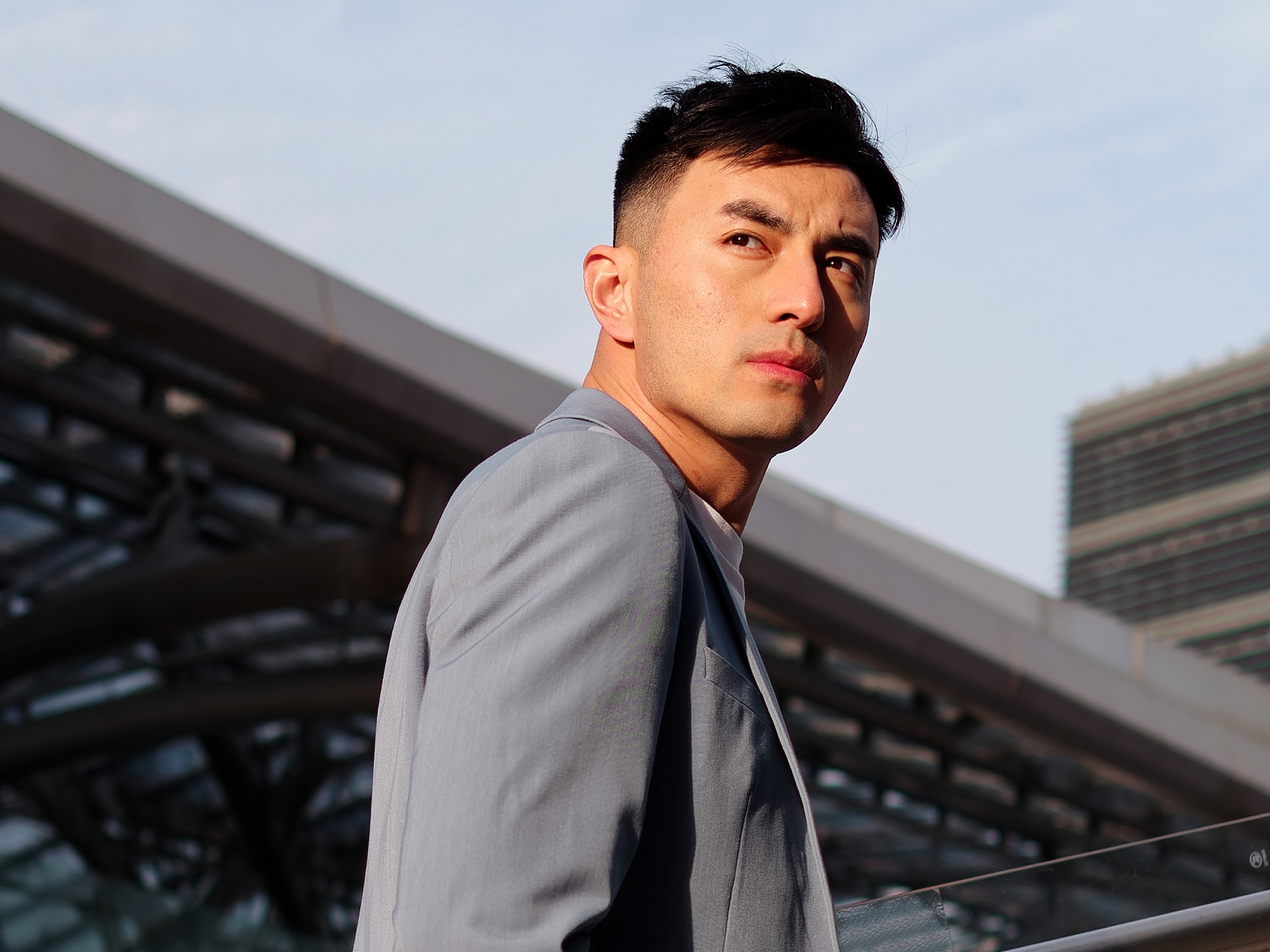 Bakersfield Med Spa model in stylish blazer outdoors, looking confidently.