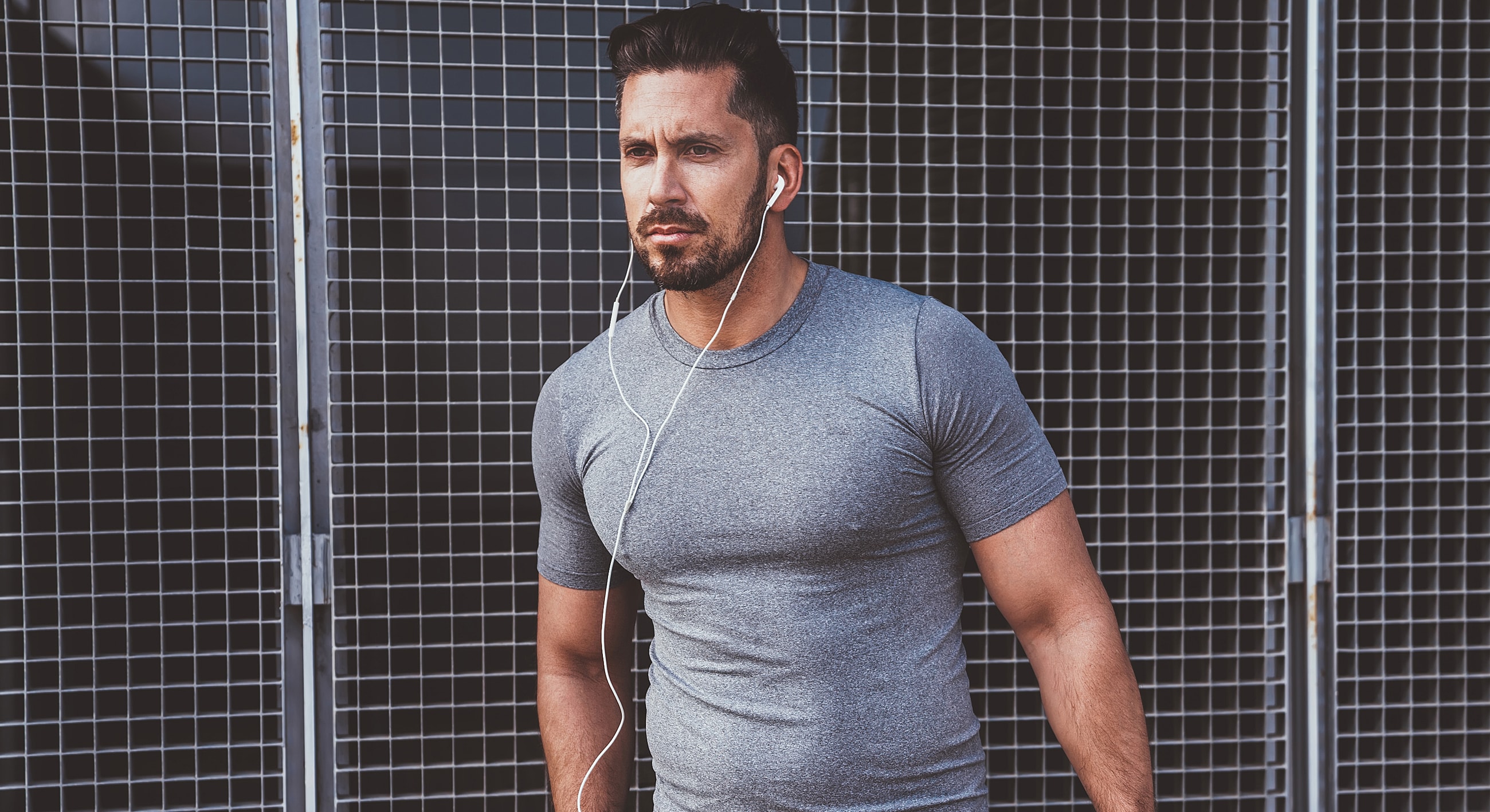 Bakersfield Bioidentical Hormone Replacement Therapy model in gray shirt listening to music outdoors.